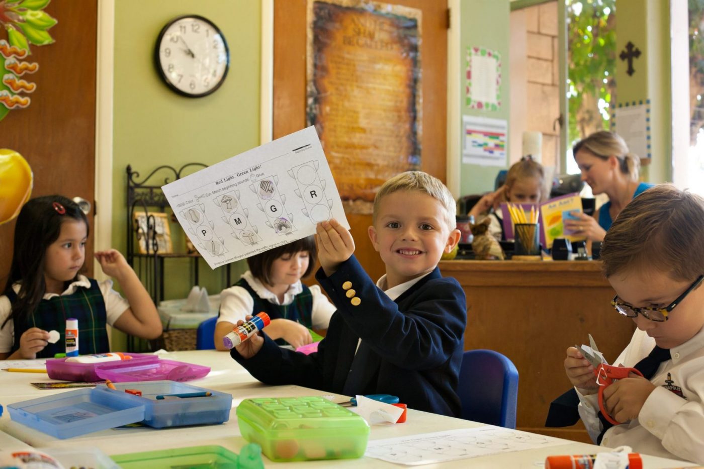 Young Boy with Homework in Classical Christian School Classroom