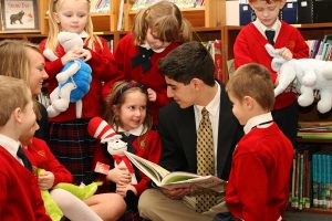 High School and Kindergartners in a Christian School Classroom